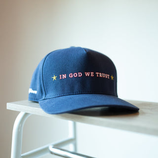 The Omega | IN GOD WE TRUST